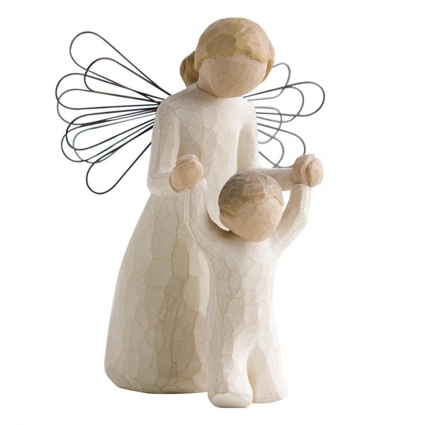 Guardian Angel by Willow Tree. Female angel in cream dress and wire wings, holding both hands of toddler in cream onesie walking in front of angel