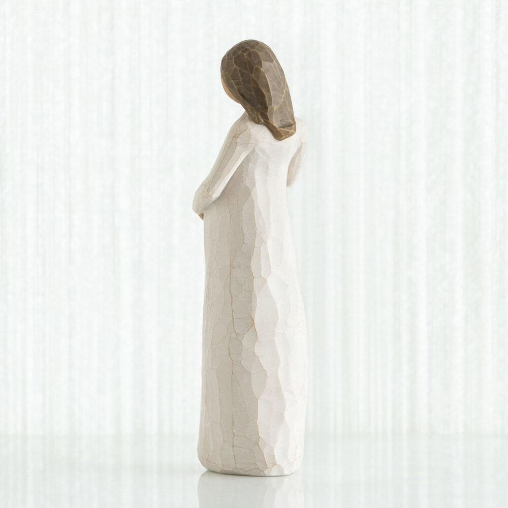Cherish by Willow Tree. Back view - Standing pregnant female figure in cream dress, with both hands on belly