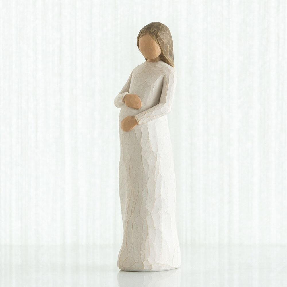 Cherish by Willow Tree. Standing pregnant female figure in cream dress, with both hands on belly