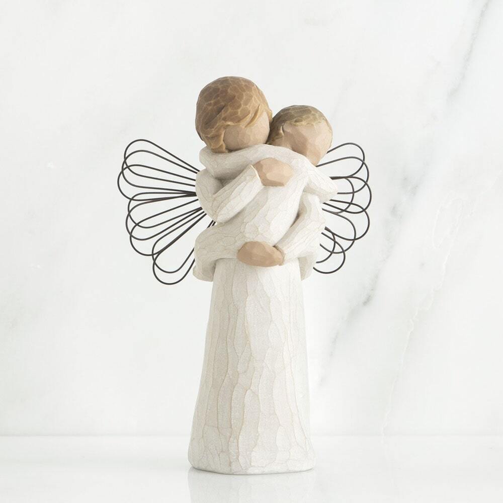 Angel's Embrace by Willow Tree. Standing female angel in cream dress with wire wings, holding baby in cream onesie, in arms