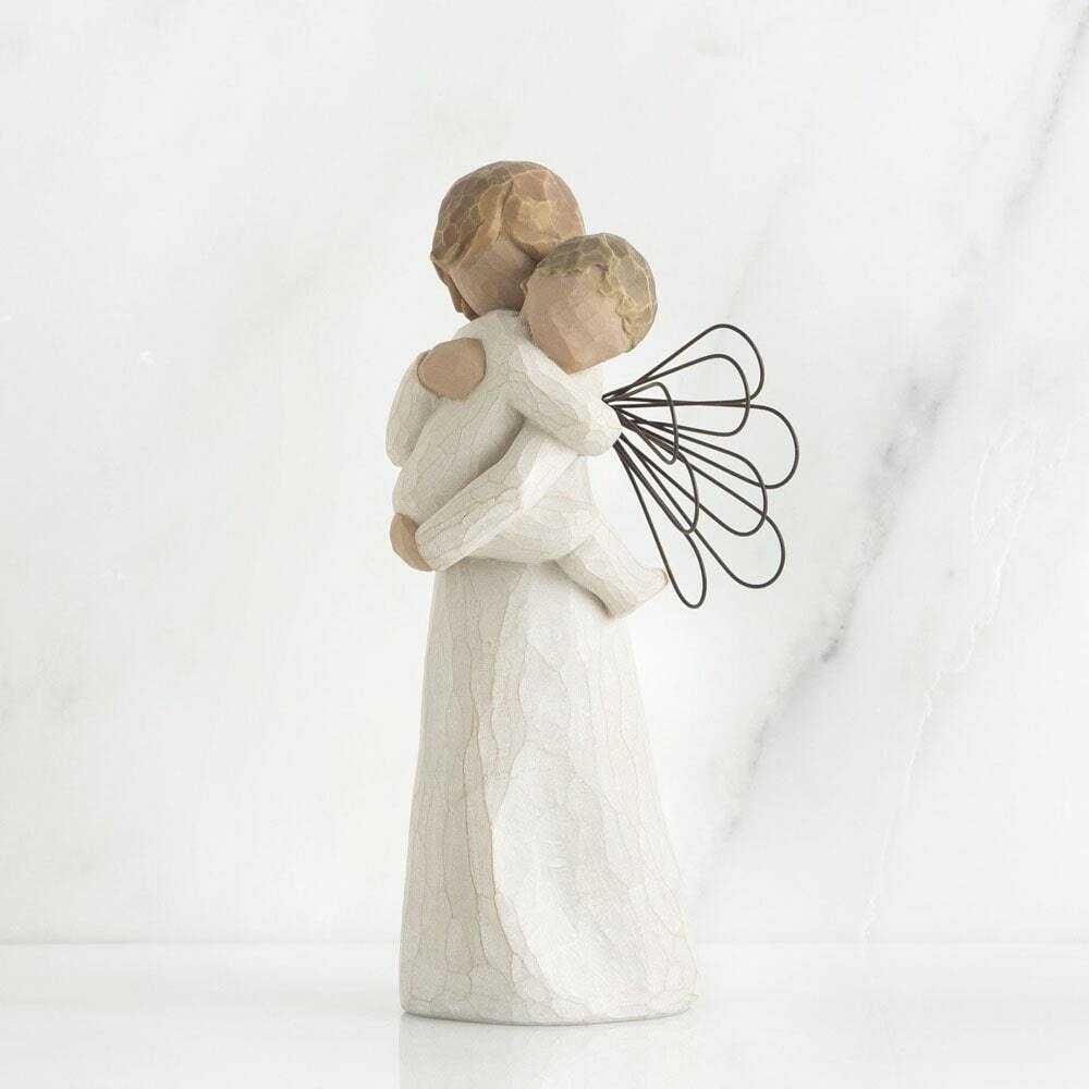 Angel's Embrace by Willow Tree. Standing female angel in cream dress with wire wings, holding baby in cream onesie, in arms