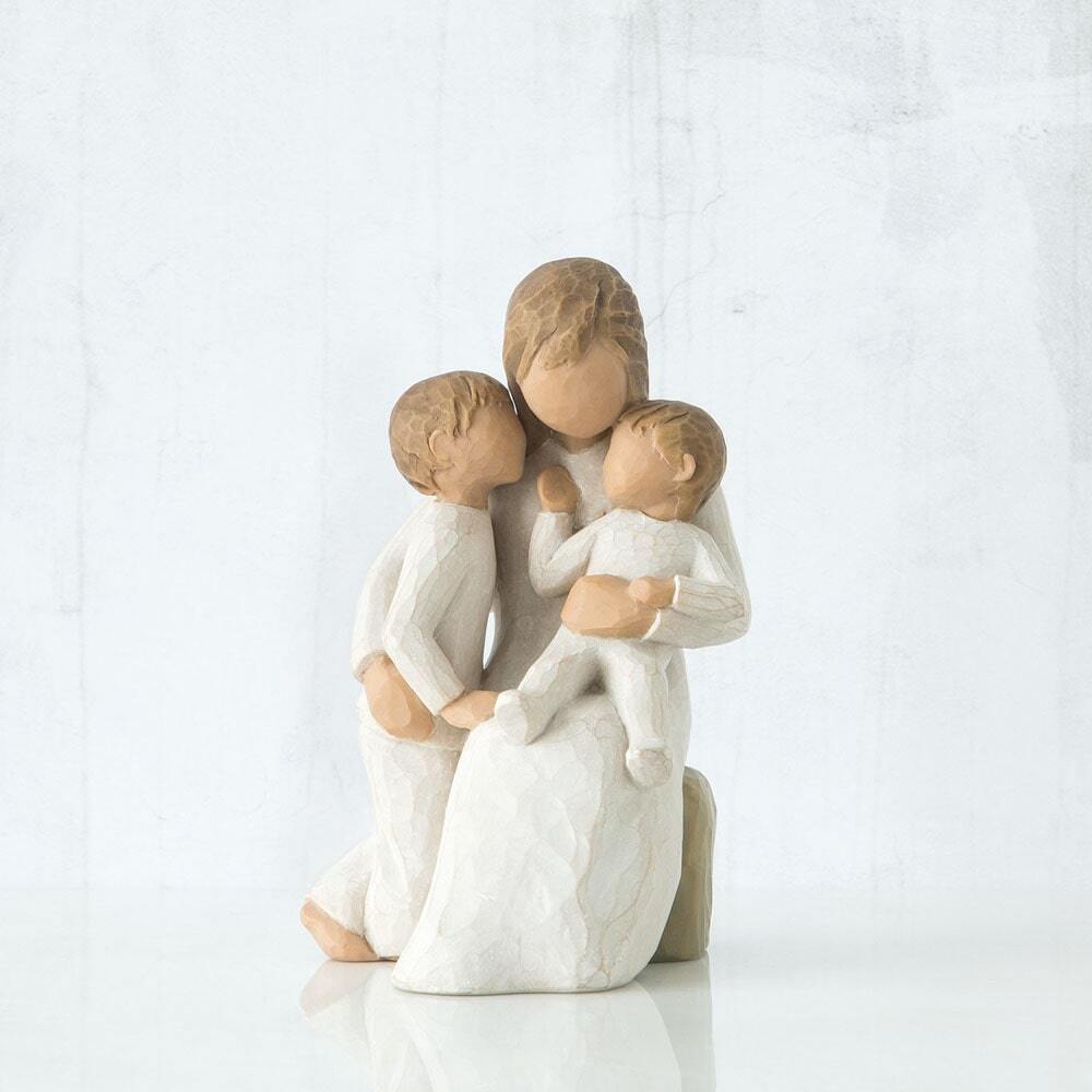 Quietly by Willow Tree. Figure of seated female in cream dress, with one arm holding small toddler, other arm around older child standing next to her; toddler and child in cream onesies