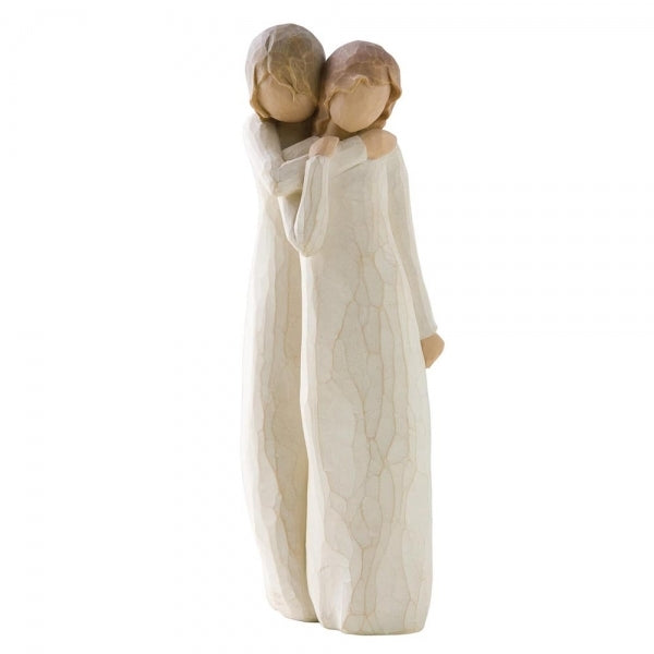 Chrysalis by Willow Tree. Figure of two women in cream dresses; one woman standing behind and embracing other woman