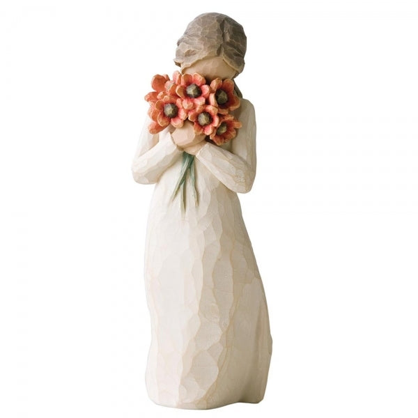 Standing figure in cream dress, holding large bouquet of red-orange poppies up to her face