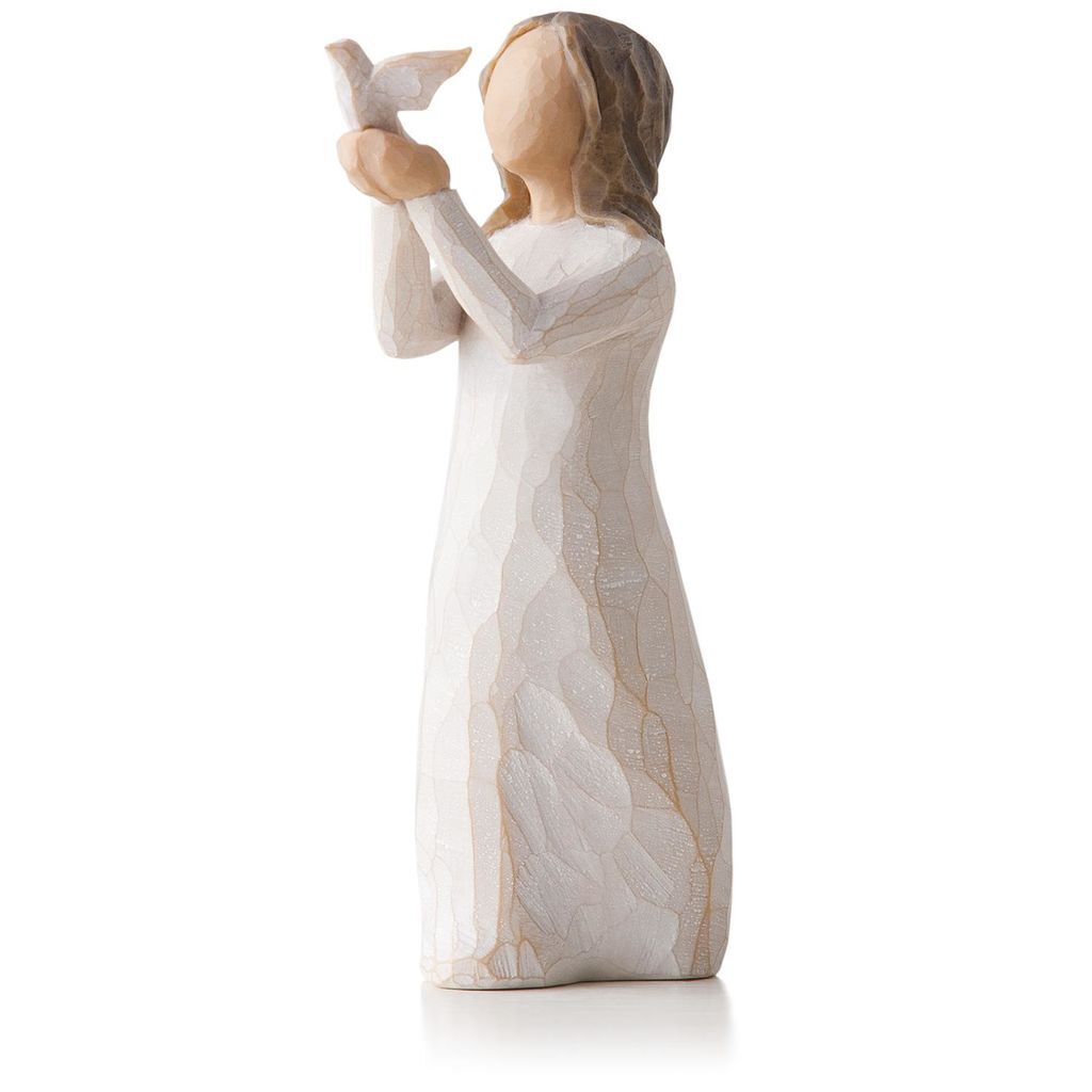 Standing female figure in cream dress holding a white dove on extended arms