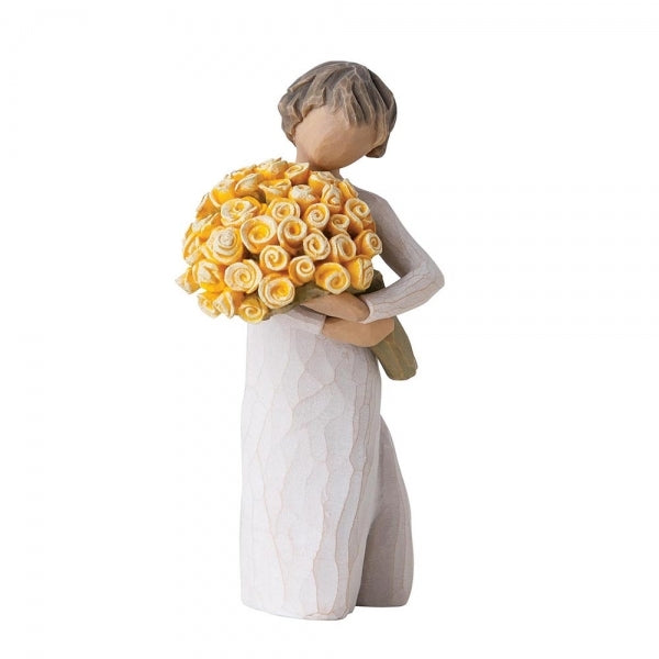 Standing figure in cream dress, holding large bouquet of yellow roses in her arms