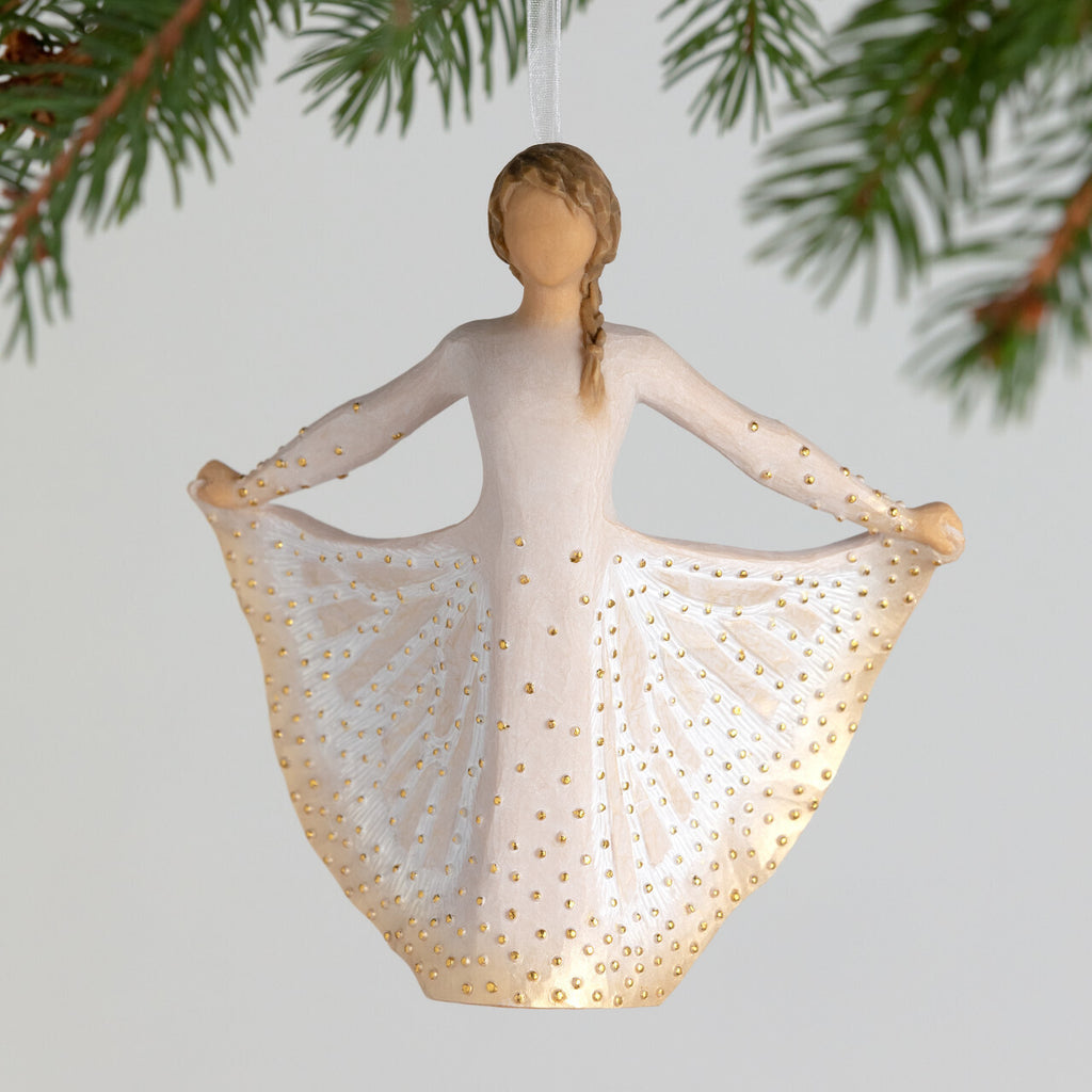 Butterfly Ornament by Willow Tree. Figure in cream dress, holding sides of her skirt out with both hands. Skirt has carved markings of a monarch butterfly, dotted with gold leaf. Hook and loop affixed to figure's head