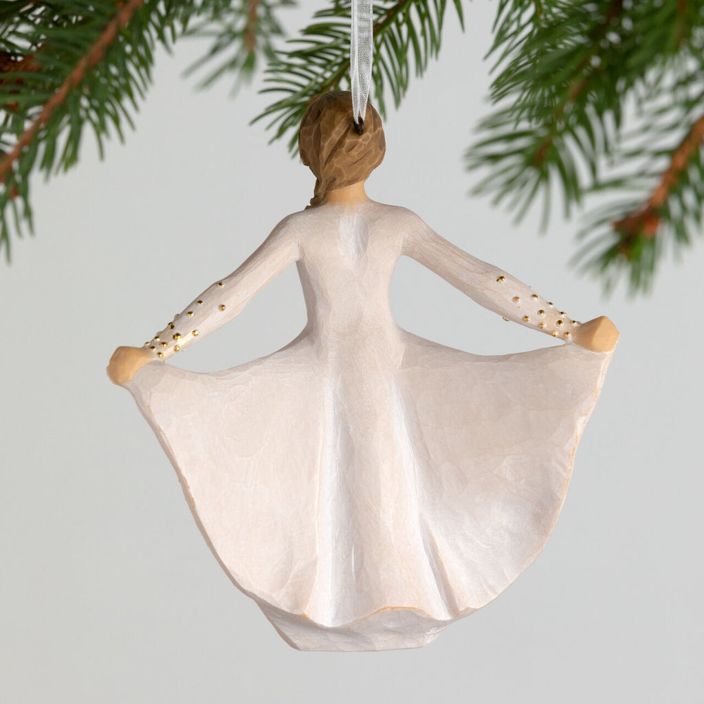 Butterfly Ornament by Willow Tree. Back View - Figure in cream dress, holding sides of her skirt out with both hands. Skirt has carved markings of a monarch butterfly, dotted with gold leaf. Hook and loop affixed to figure's head