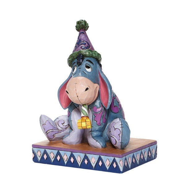 DISNEY TRADITIONS<BR> Eeyore with Birthday Hat/Horn <BR> “Birthday Blues"